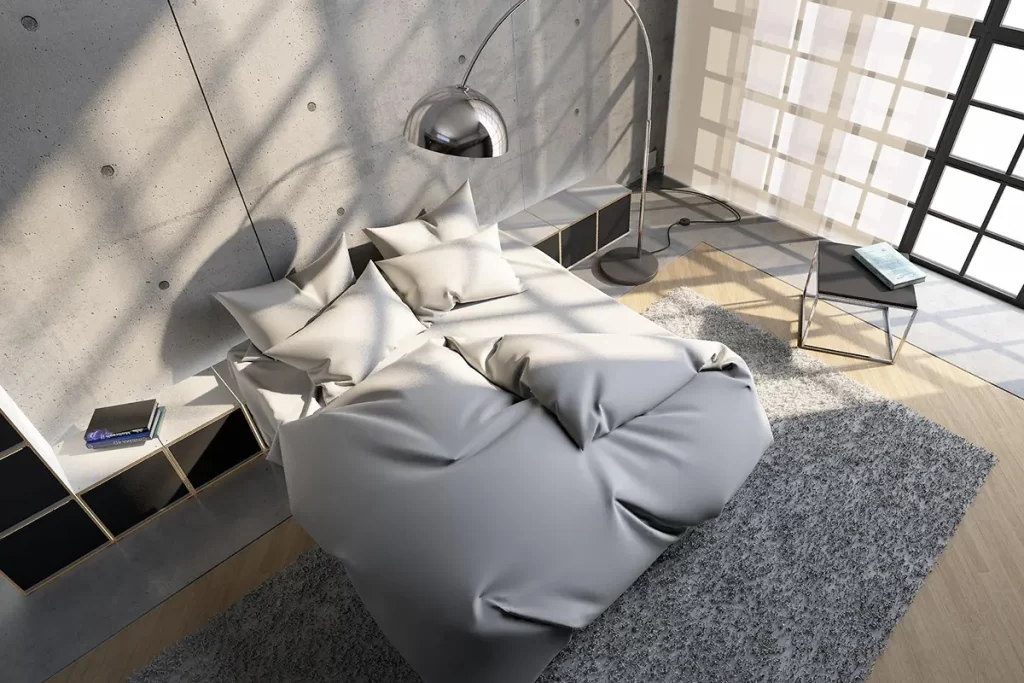Render 3D de dormitorio moderno con cama gris, iluminación natural de tarde y reflejos realistas creado con tecnología V-Ray.